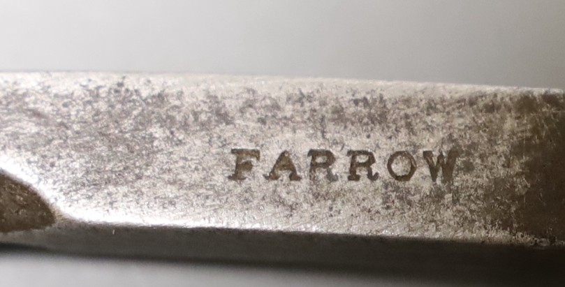 A Farrow bottle seal cutter and brush